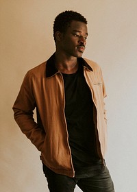 Brown short jacket mockup on African Amercan male model in studio