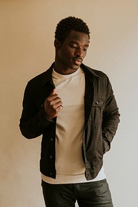 Men's black jeans jacket mockup on African American male model in studio shot