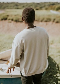 White college sweater mockup male model outdoor shoot psd