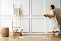 Woman doing house chores in a Japandi interior home 