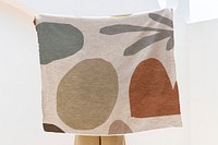 Throw blanket in abstract pattern in beige