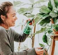 Woman tending and caring for her plants