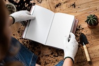 Empty book in the hands of a gardener