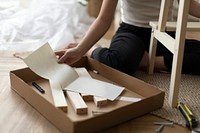 Woman assembling a diy chair from scratch