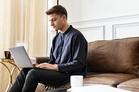 Man using a laptop and working from home