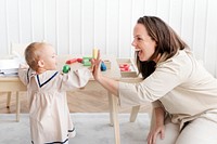 Baby making high five with her mother