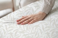 Hand on a soft duvet