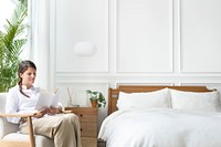 Woman reading a book in her bedroom