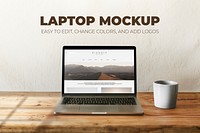 Laptop psd mockup with coffee mug on wooden table