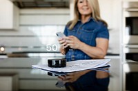 Woman listening to weather news on a smartphone