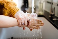 Boy washing hands in the new normal