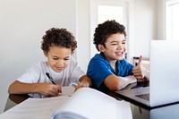 Brothers doing homework at home during the new normal