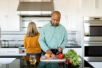 Couple cooking breakfast together at home