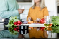 Happy couple listening to music in the kitchen