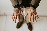 Man with old school tattoos on his hands. 2 OCTOBER 2020 - CHIPPENHAM, UK