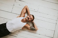 Handsome man in white tank top fashion shot