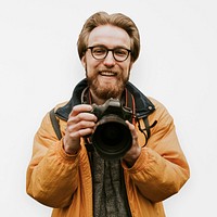 Smiling photographer isolated mockup psd man holding his camera