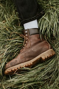 Man in brown ankle leather boots closeup