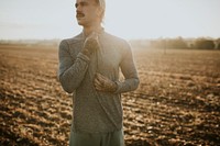 Cool urban man listening to music while working out