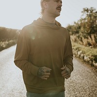 Hoodie mockup psd with man running outdoors