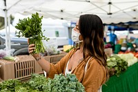 Woman shopping for vegetable, buying at fresh market