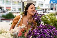 Woman doing flower shopping at a local market