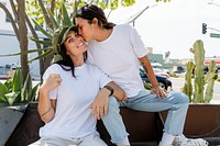 Cute lesbian couple kissing image in matching clothes