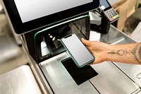 Phone screen mockup psd, held by a woman doing contactless payment