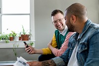 Gay couple paying bills, HD stock image