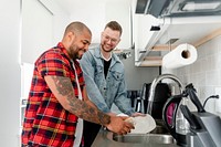 Gay couple washing dishes, happy marriage HD photo