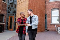 Happy gay couple walking in the city, lifestyle stock image