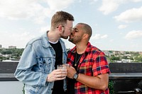 Cute gay couple kissing while on a date