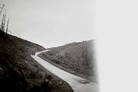 Car driving through the lonely road in the mountains