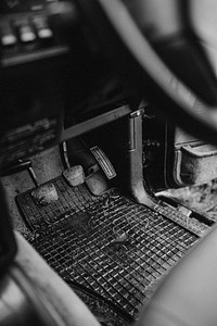 Wet car brake pedal in an empty driver's seat