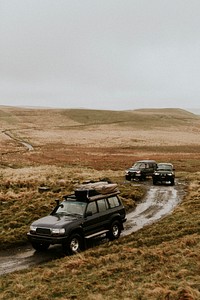 Cars driving through the off-roading path