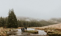 Men outdoors in rainy weather mountain landscape