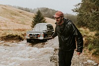 Man pulling the car towing cable