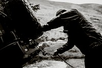 Man pulling the car towing cable