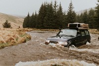 Car stuck in a stream waiting for rescue