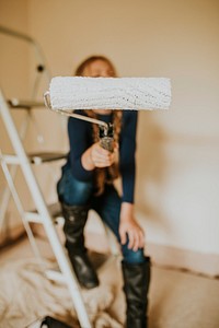 Child painting walls for home transformation