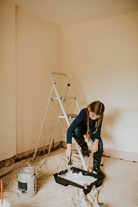 Child painting walls for home transformation