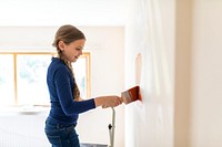 Child painting walls for home transformation
