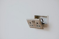Broken power outlet on the wall