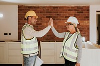 Woman and man contractor teamwork high five