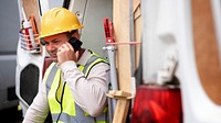 Construction worker on the phone near a construction site