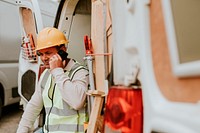 Construction worker on the phone near a construction site