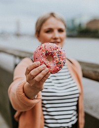 Woman sharing a donut 