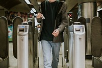 Person walking through a turnstile