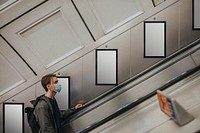 Billboard screen by underground escalator 