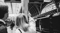 Colleagues travelling together on a train platform 